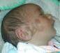 Baby's face with the name Muhammad written on it إسم محمد على خد رضيع